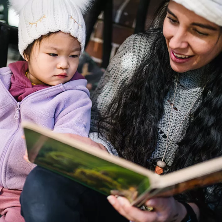 Child and educator reading